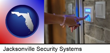 woman pressing a key on a home alarm keypad in Jacksonville, FL