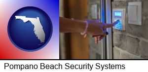 Pompano Beach, Florida - woman pressing a key on a home alarm keypad