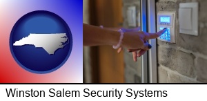 Winston Salem, North Carolina - woman pressing a key on a home alarm keypad