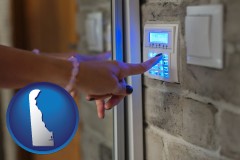 delaware map icon and woman pressing a key on a home alarm keypad