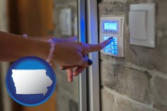 iowa map icon and woman pressing a key on a home alarm keypad