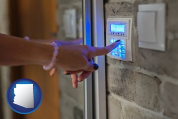 woman pressing a key on a home alarm keypad - with Arizona icon