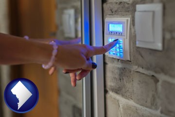 woman pressing a key on a home alarm keypad - with Washington, DC icon