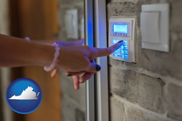 woman pressing a key on a home alarm keypad - with Virginia icon