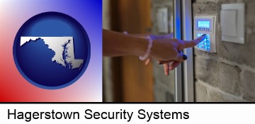 woman pressing a key on a home alarm keypad in Hagerstown, MD