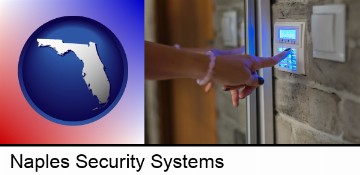 woman pressing a key on a home alarm keypad in Naples, FL