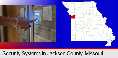 woman pressing a key on a home alarm keypad; Jackson County highlighted in red on a map