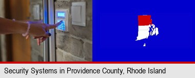 woman pressing a key on a home alarm keypad; Providence County highlighted in red on a map